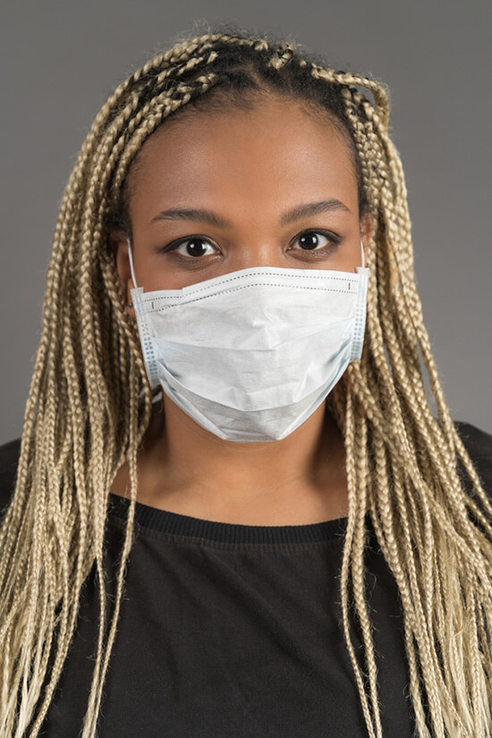 A woman wearing a medical mask